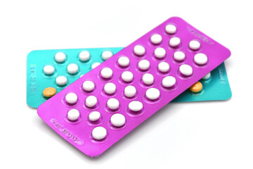 Colorful oral contraceptive pill strips.