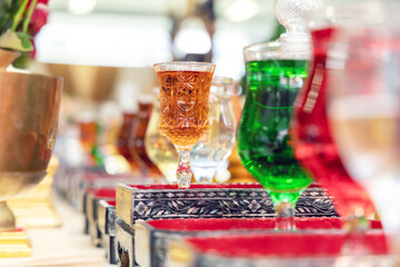 Beautiful liquor glass on the ritual table to be used in Asian celebrations.