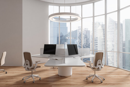 Workplace in white open space office with round table