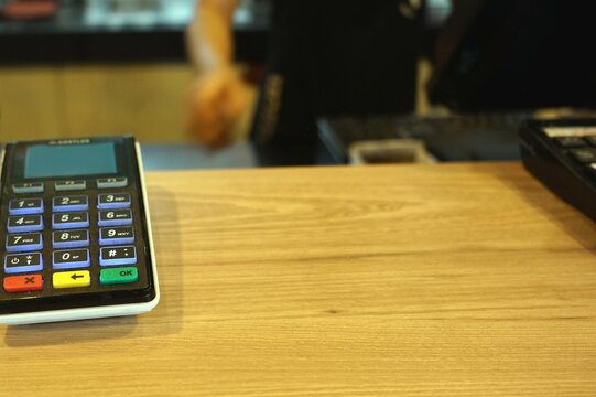 A credit card reader on the tables for service a customers.