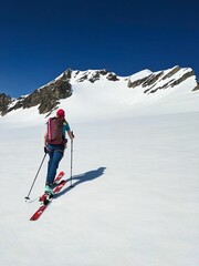 Fototapeta na wymiar Backcountry Ski tour on the Clariden in Glarus Uri. Skitour over the glacier in the Swiss Alps. Skimo mountaineering. High quality photo