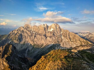 Hike to the Fronalpstock with a view of the Mürtschenstock in Glarus. Beautiful evening mood in the Swiss mountains. High quality photo