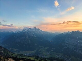 Evening mood on the Fronalpstock Glarus mountain peak. wanderlust. View of the Glarnisch Massif above Netstal. High quality photo