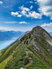 Hiking on the breathtaking Hardergrat in the Bernese Alps. Extremely dangerous path on the mountain ridge. High quality photo