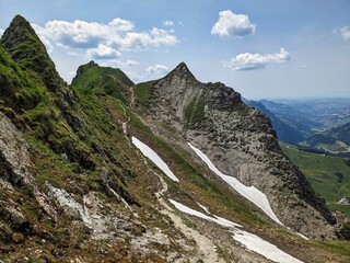 Hiking  on the Hardergrat. Hiking on the harder ridge. Breathtaking view above Lake Brienz. Brienzer Rothorn. High quality photo