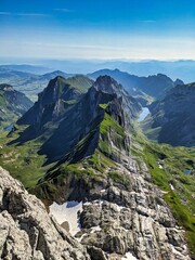 Fototapeta na wymiar Climbing on the Altma Altmann in the Alpstein Appenzell area. Fantastic mountain panorama. Wanderlust Switzerland. Fahlensee lake. Faelensee. High quality photo