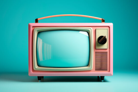 Retro old portable television on colored background