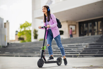 Happy student on scooter outside on fresh air © Mediteraneo