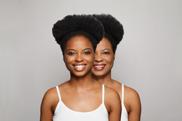 Healthy female models. Two women studio portrait. Young and senior face