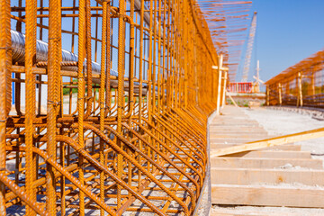 Steel rusted reinforcement bars placed for strength of bridge on the construction site.