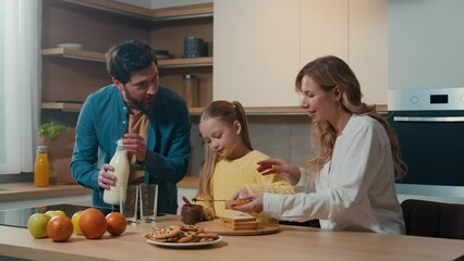 Caucasian happy family at kitchen morning breakfast with food delivery service parents mother father with child daughter kid girl cooking toasts bread with chocolate pasta dad pour milk into glasses - Powered by Adobe