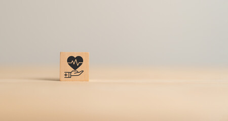 Health insurance concept. Healthcare, finance and medical service. Wooden cube block with hand...