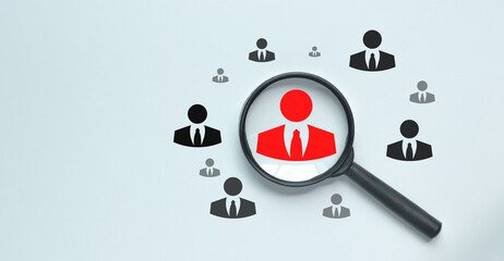 HRM or Human Resource Management, Magnifier glass focus on manager icon, one of employee icons for leadership recruitment.