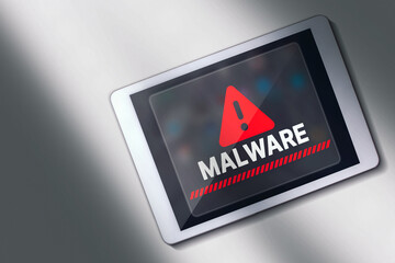 Desktop view photo of malware alert on digital tablet screen. Compromised information concept. Internet virus cyber security and cybercrime.