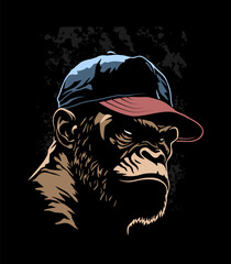 Angry gorilla head in the baseball cap on a dark background.
