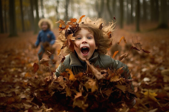 Children having fun with piles of autumn leaves