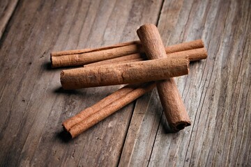 Sweet Temptation: Close-Up of Cinnamon Rolls Placed on a Wooden Surface, Tempting Your Senses in 4K Resolution