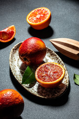 red orange. Ripe blood orange slice on plate. vertical image. top view. place for text