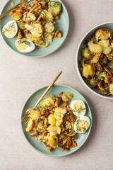 Delicious hearty dinners or lunches, fried young potatoes with forest mushrooms Chanterelles with dill, boiled eggs, seasonal food