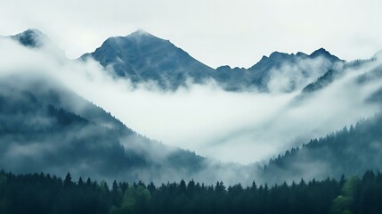 a mountain with clouds around it
