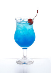 Blue cocktail with ice and cherry in a Poco Grande Glass isolated on white background. Mermaid mule cocktail.