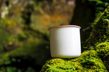 Expertly composed, the mockup presents a white blank mug in the beauty of nature, effortlessly...