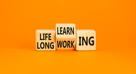 Lifelong learning working symbol. Concept word Lifelong learning working on block on a beautiful...