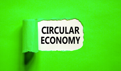 Circular economy symbol. Concept words Circular economy on beautiful white paper. Beautiful green background. Business circular economy concept. Copy space.