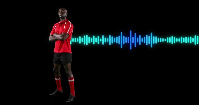Animation of african american male athlete standing arms crossed over soundwave on black background