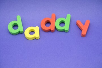 Daddy in colourful lower case letters
