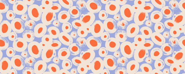 Seamless pattern with red grunge dots and blue background. Hand drawn round doodle shapes in grunge style. Abstract blobs, spots, circles and organic round shapes. Random naive spots texture.