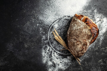 Fresh homemade crisp bread on a dark background. banner, menu, recipe place for text, top view