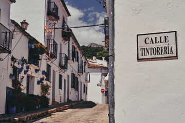 Street sign the direction way to spanish, beautiful and typical Andalusian street