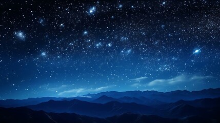 a starry night sky over mountains
