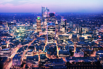 City of London business and banking area at nigh with beautiful lit up skyscrapers and streets.  UK