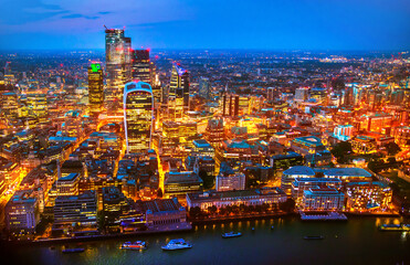 City of London business and banking area at nigh with beautiful lit up skyscrapers and streets.  UK
