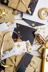 Chic gift wrapping and tags with golden accents and star shapes. Elegant gift wrapping scene...