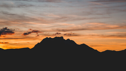 Beautiful mountain sunset with the silhouette of the peaks