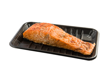 Grilled salmon fillet on black plastic tray isolated on white background