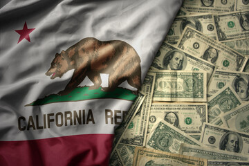 colorful waving national flag of california state on a american dollar money background. finance...