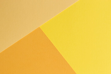 The paper yellow and orange colors is lying on the table
