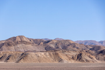 Fototapeta na wymiar Colorful mountain range with a perfect blue sky near Pan de Azúcar National Park in the Atacama desert in Chile, South America