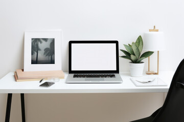 Fototapeta premium Home office with laptop on the table.