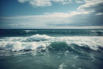 Fototapeta na wymiar Waves on the beach on a cloudy day