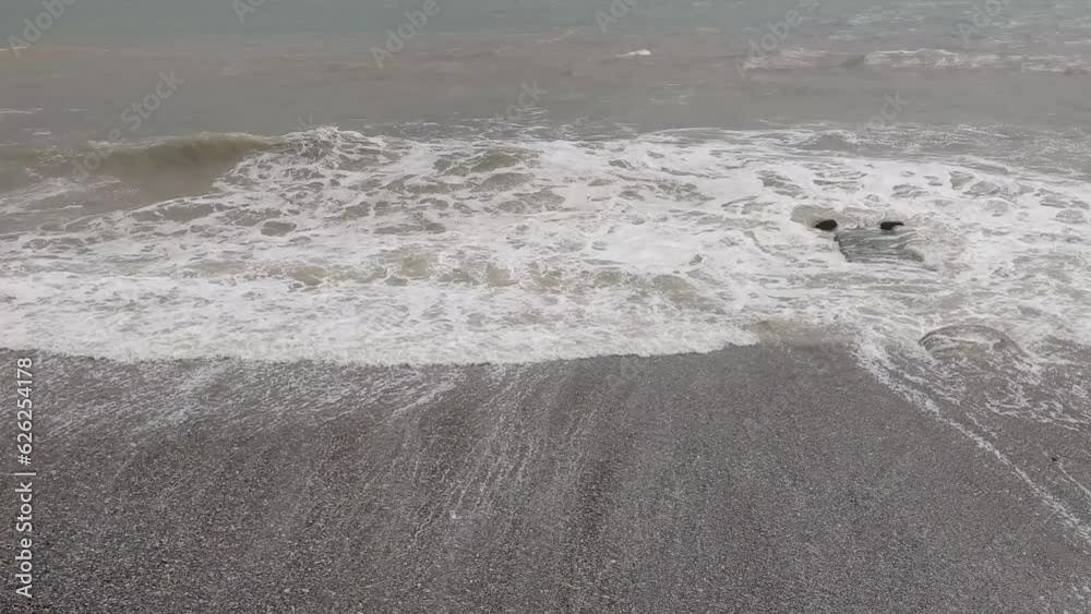 Poster sea with waves in cloudy weather.