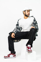 A visually appealing mockup displays a man wearing a white blank shirt and hat, exuding elegance...