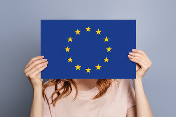woman holds blank white speech bubble with european union flag isolated
