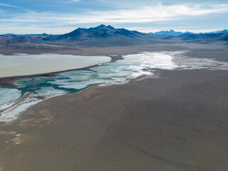 Aerial view of the green and partly frozen Laguna del Negro Francisco in the Atacama desert in...