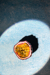 half of fresh passion fruit, vertical image. top view. place for text