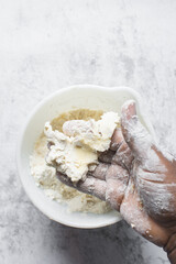 butter and flour being mixed together, butter and flour mixed into rough pastry, butter and flour being use to make cookie dough or pie dough
